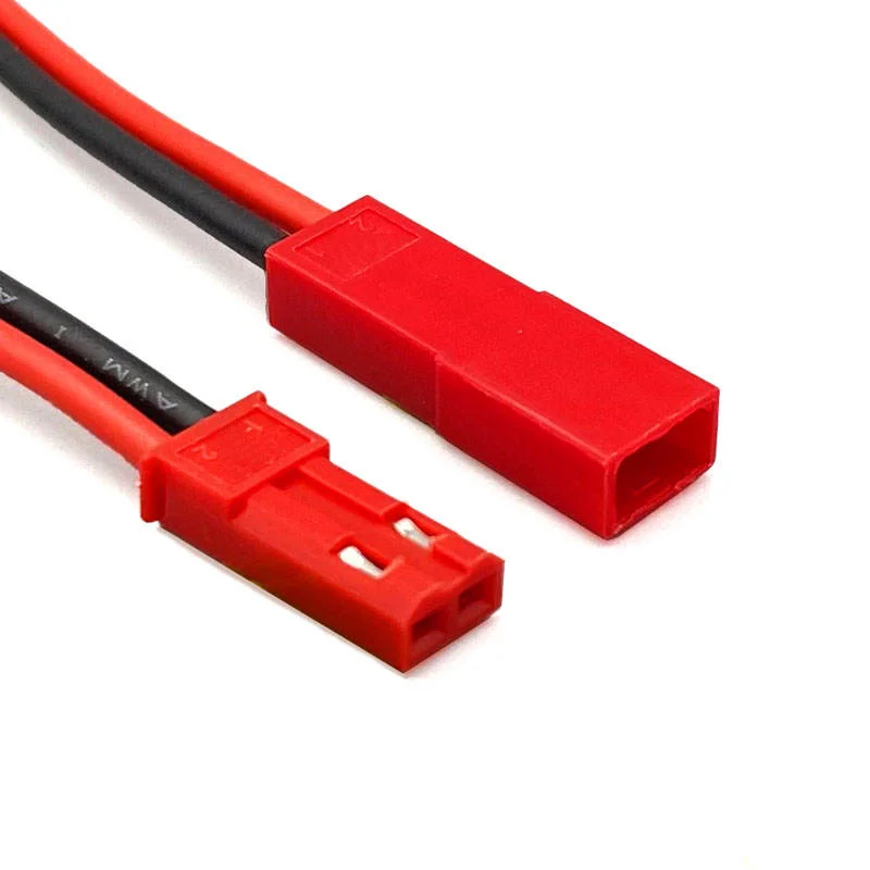 Close-up of two complementary red RCY connector halves with wire entry and mating openings visible